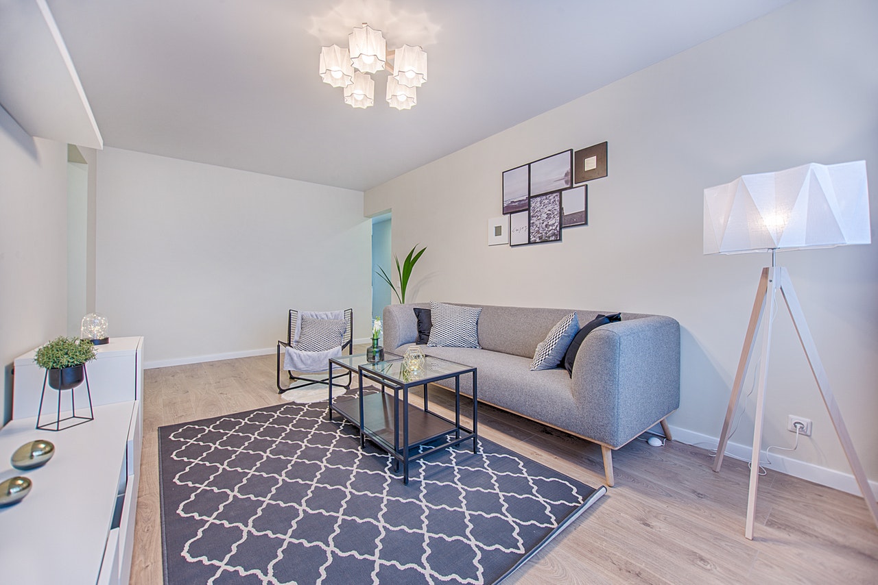 gray-fabric-sofa-placed-indoor-1571468